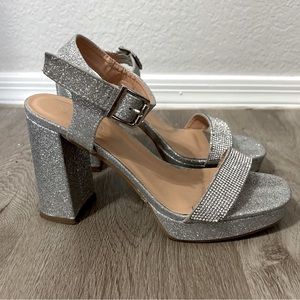 These slightly worn high heels are a size eight.